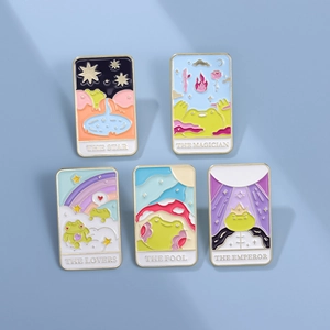 Cartoon tarot frog enamel pins set featuring star and magician designs on blue background