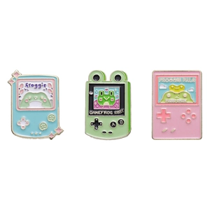 Cute set of three frog-themed retro handheld game console enamel lapel pins in soft colors