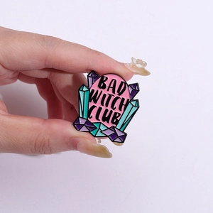 Bad Witch Club enamel pin with pink background and colorful geometric crystals