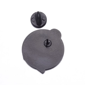 Detail view of the punk skull enamel pin back with durable black rubber clutch fastener