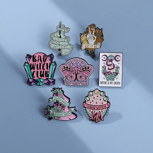 7-piece mystic enamel pin set with skull butterfly and tarot designs on blue background
