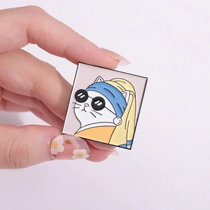 Detailed macro view of an irregular square enamel pin featuring a cartoon cat parody artwork