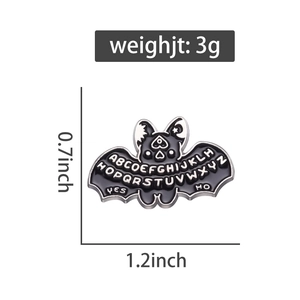 Gothic bat enamel pin with Ouija letters, size 1.2 x 0.7 inches and weight of 3 grams
