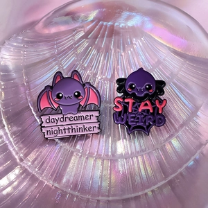 Cartoon bat enamel pins with daydreamer nightthinker and stay weird slogans set
