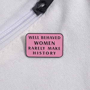 Pink enamel brooch with 'Well Behaved Women Rarely Make History' on canvas bag