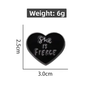 She IS FIERCE black enamel heart pin detail showing 3.0cm x 2.5cm size and 6g weight