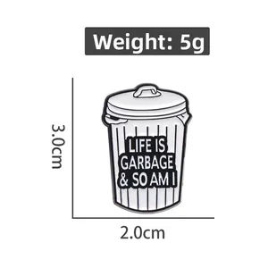 Detail view of a trash can enamel pin with dimensions 3.0cm x 2.0cm and weight 5g