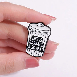 Enamel bin pin badge with Life Is Garbage & So Am I quote in punk style black and white