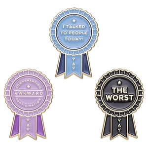 Three colorful enamel award medals with humorous social achievement text on white background
