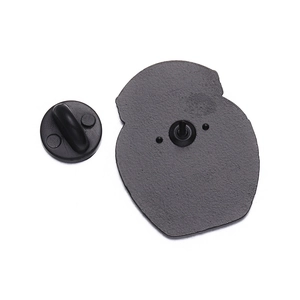 Detail view of the black metal brooch back with secure rubber clutch backing