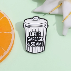 Funny enamel pin shaped like a trash can with Life Is Garbage & So Am I slogan