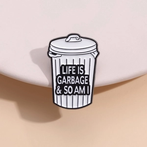 Funny trash can enamel pin badge featuring Life is Garbage slogan in black and white