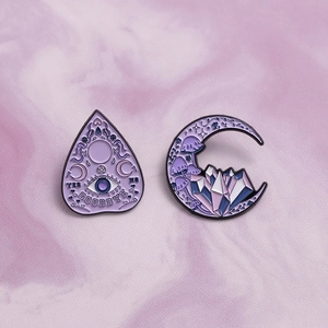 Purple mystical enamel pins set featuring crescent moon and planchette with occult details