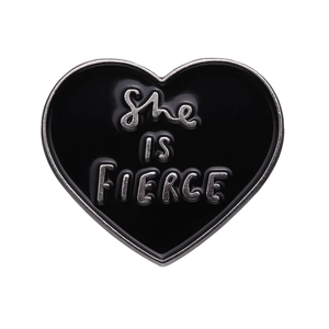 Minimalist heart enamel brooch featuring silver She IS FIERCE lettering on black base