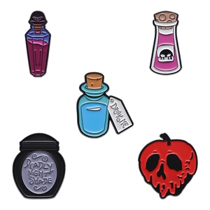 Five-piece set of Halloween enamel pins featuring spooky bottles and poison apple motifs