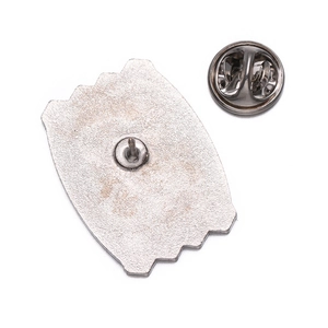 Detailed back view of a metal brooch with a textured finish and secure butterfly clutch