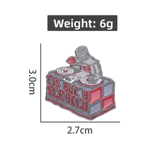 Detail of knight DJ enamel pin featuring Tis But A Scratch text, 3.0cm x 2.7cm size