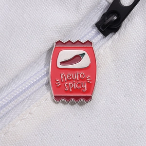 Vibrant red enamel potato chip bag pin featuring chili design and neuro spicy text