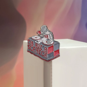 DJ Black Knight enamel pin with Monty Python 'Tis But A Scratch movie quote for bags