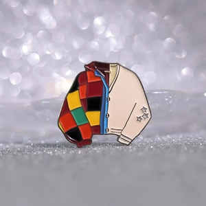 Enamel cardigan coat brooch with colorful checkered pattern on silver glitter background