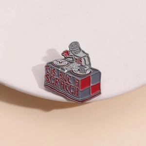 Creative DJ knight enamel pin with 'Tis but a scratch' text on a minimalist background