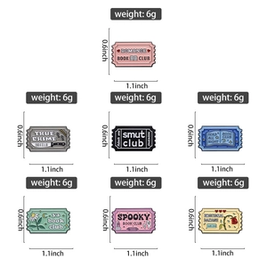 Macro detail of enamel book lover stamp pins showing dimensions and diverse book themes