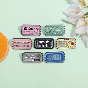 Set of colorful enamel book club pins in ticket shapes with hand-drawn illustrations