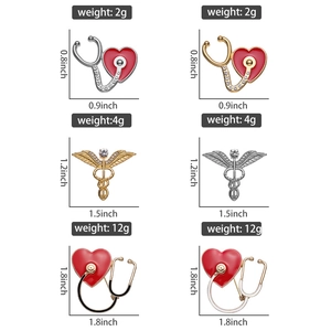 Detail view of medical brooches showing stethoscopes and caduceus with dimensions