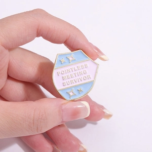 Enamel shield pin featuring Pointless Meeting Survivor text with gold star accents