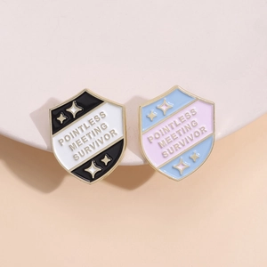 Creative enamel shield badges with Pointless Meeting Survivor slogan in two colors
