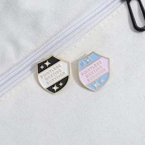 Enamel brooch with Pointless Meeting Survivor text on white canvas background
