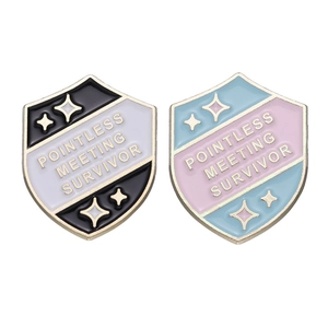 Shield-shaped enamel pins featuring Pointless Meeting Survivor text in two colors