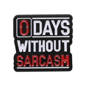Black enamel pin with 0 DAYS WITHOUT SARCASM text slogan for clothing and bags