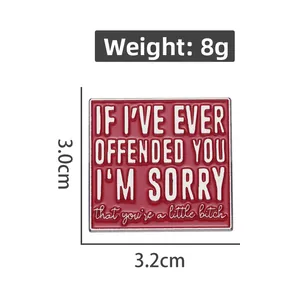 Detail view of red enamel brooch with white slogan, size 3.0cm x 3.2cm, weight 8g