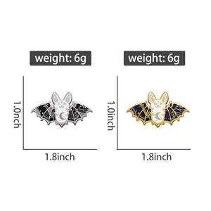 Detailed view of gothic bat enamel pins with dimensions 1.8x1.0 inches weighing 6g