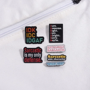 Set of six irregular metal enamel pins with sarcastic English slogans on white canvas