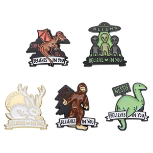 5-piece set of cartoon alien and creature enamel pins with believes in you message