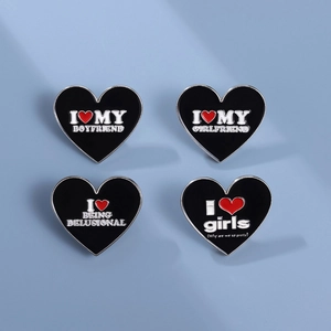 Set of four black enamel heart pins featuring I Love My Boyfriend and Girlfriend slogans