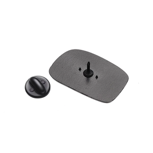 Detail of matte black alloy badge back showing secure pin and rubber clutch fastener