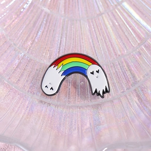 Cute rainbow white ghost enamel brooch with heart eyes on a pink shell tray