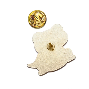 Detailed back view of the golden frog pin badge featuring the butterfly clutch fastener