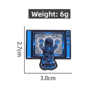 Detailed view of Poltergeist enamel pin with 6g weight and 2.7x3.0cm size dimensions