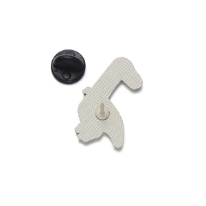 Detail view of the silver metal brooch back with textured pattern and black rubber clutch