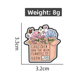 Detail of floral enamel pin featuring Luke 12:27 quote and colorful wild flowers