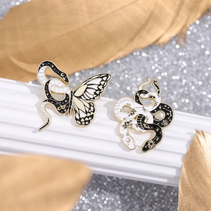 Exquisite snake and butterfly enamel brooches with celestial moon and sun patterns