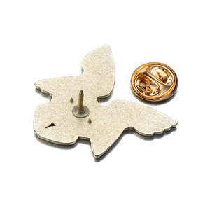 Detailed back view of enamel pin showing sharp needle and golden butterfly clutch backing