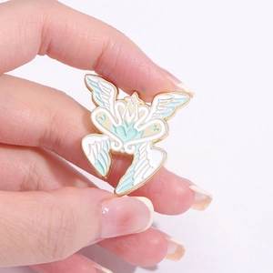 Japanese anime style alloy enamel pin featuring a winged heart with crown and gold edges