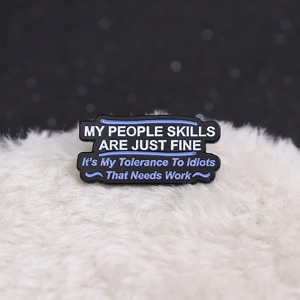 Funny banner enamel pin with sarcastic My People Skills quote on white faux fur background