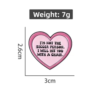 Detailed size chart for pink heart enamel pin measuring 3cm wide and 2.6cm high