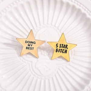 Golden star metal pins featuring Doing My Best and 5 Star Bitch text on ceramic plate
